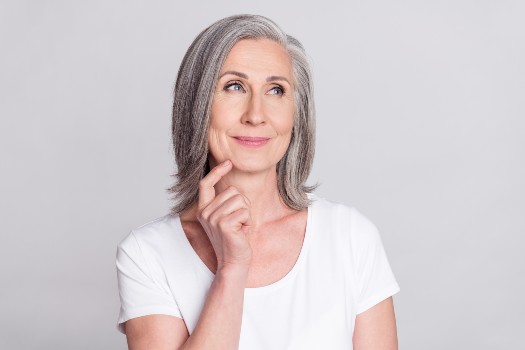 Older woman with a face with few wrinkles after LPG sessions